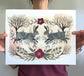 Two Spring Rabbits with Hellebore and Blooming Trees