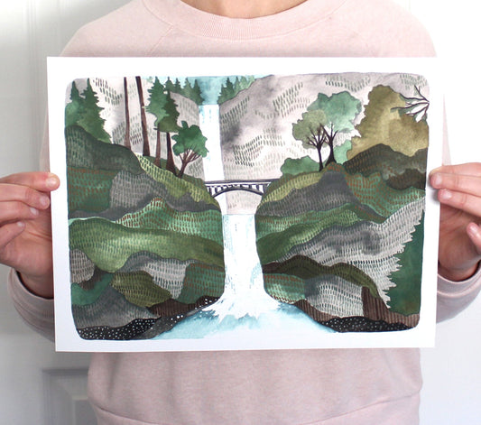  A print of Oregon's Multnomah Falls. A waterfall surrounded by green foliage. 