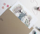 Two Spring Rabbits with Hellebore and Blooming Trees