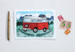 Card with a red camper van illustration on a white background
